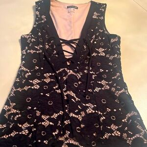 Venus black sleeveless lace up top with nude underlay. Size small